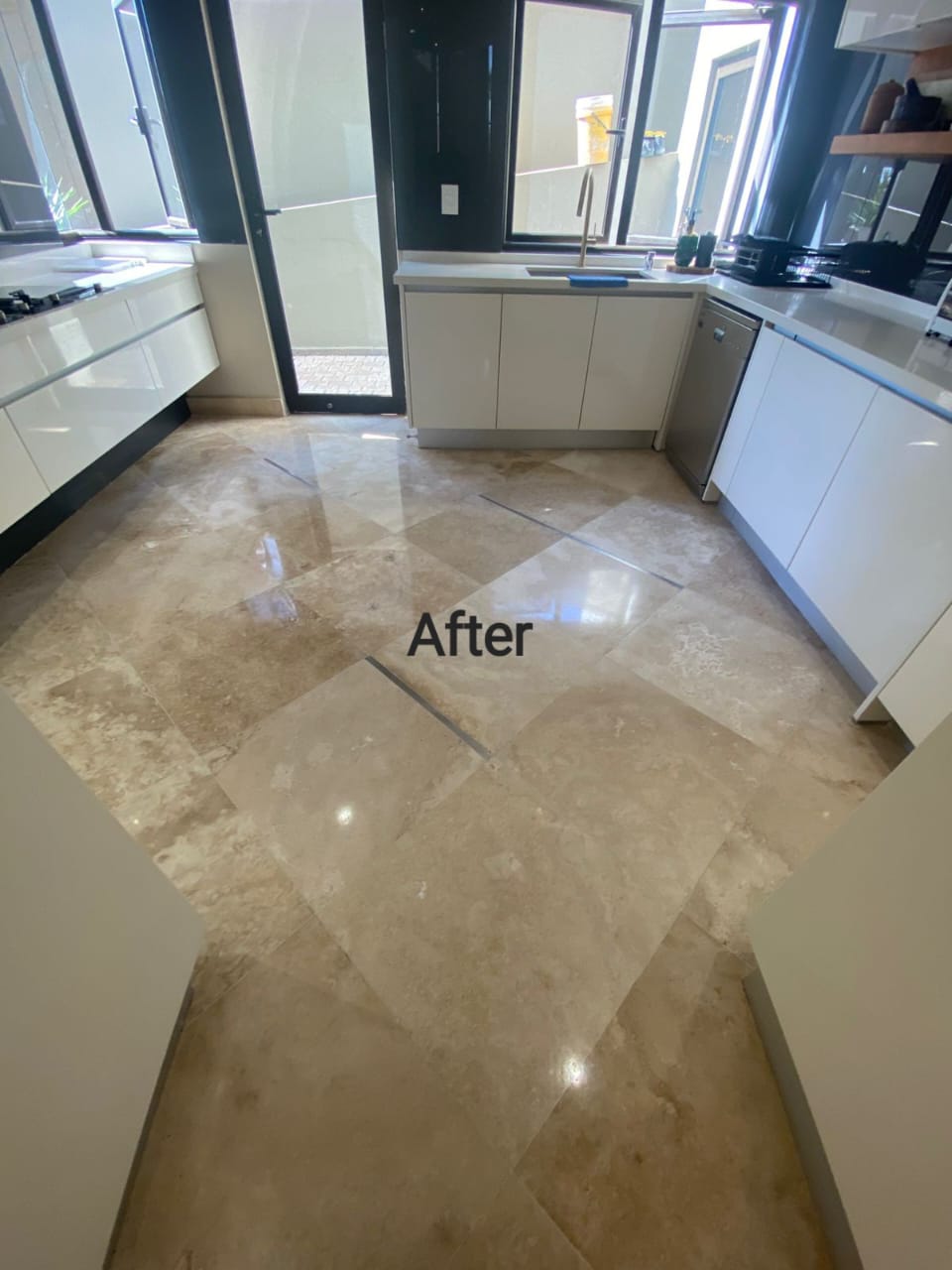 Polished kitchen natural stone floor after restoration