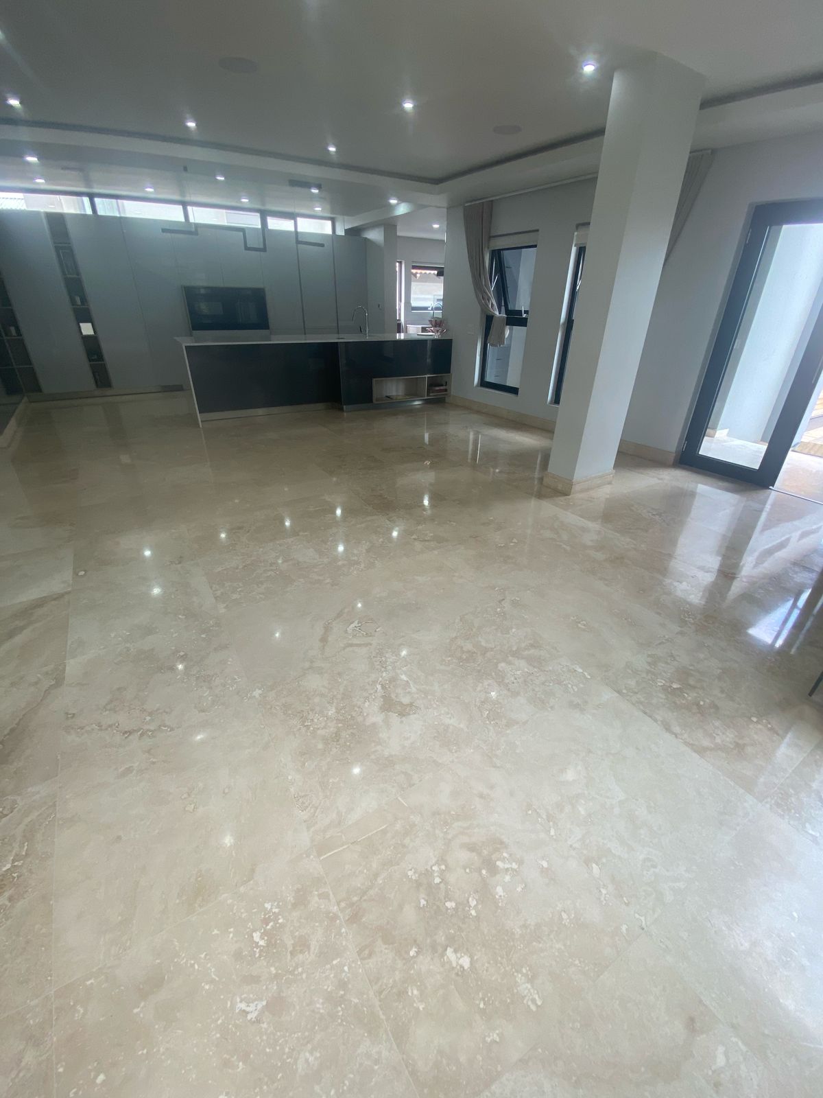 Polished stone floor with a reflective finish
